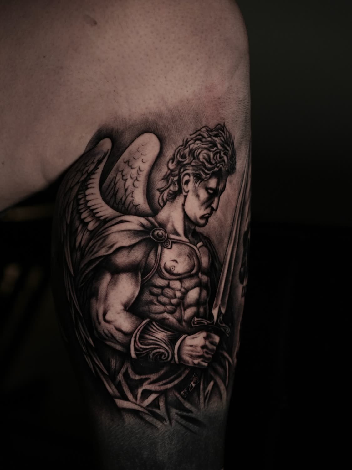 Archangel warrior with sword and wings, realism