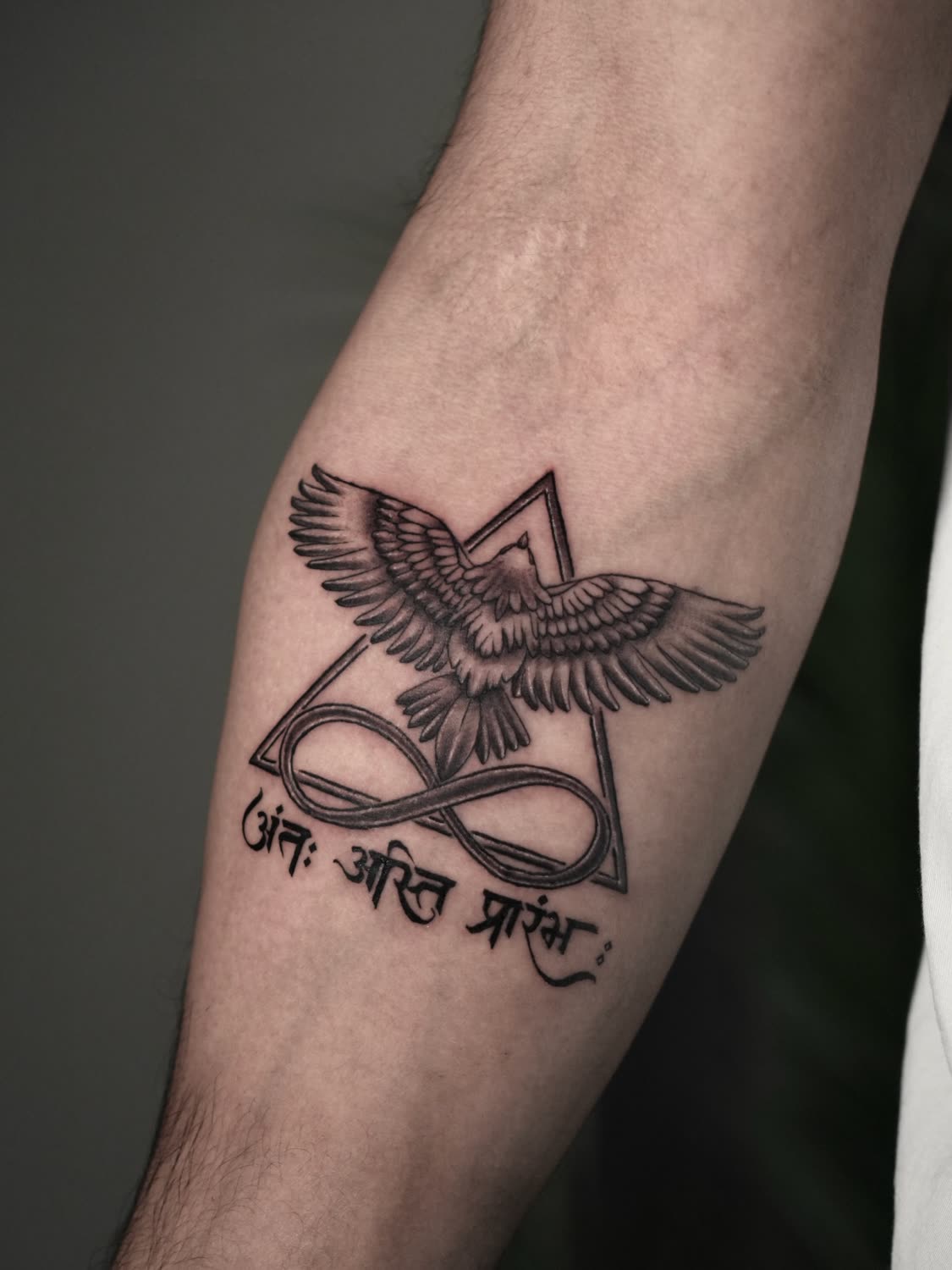 Fine-line eagle with infinity, triangle and Sanskrit script